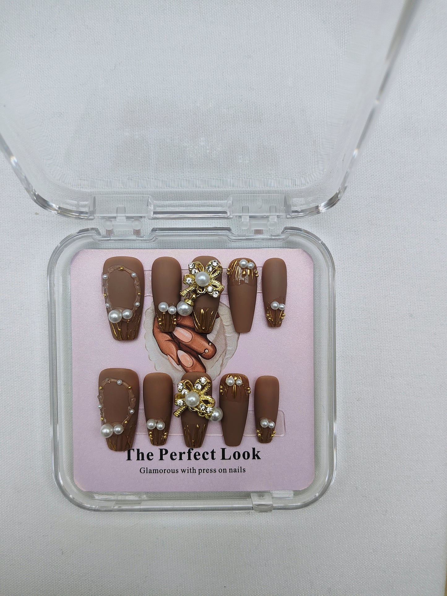 Brown nails with pearl accents