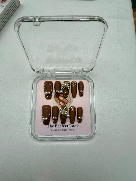 Brown nails with pearl accents