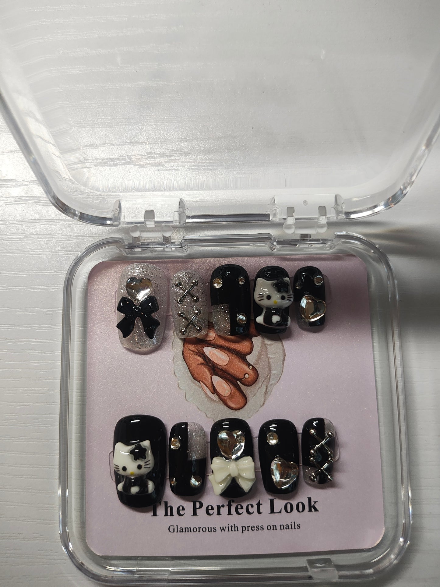Black and silver hello kitty nails