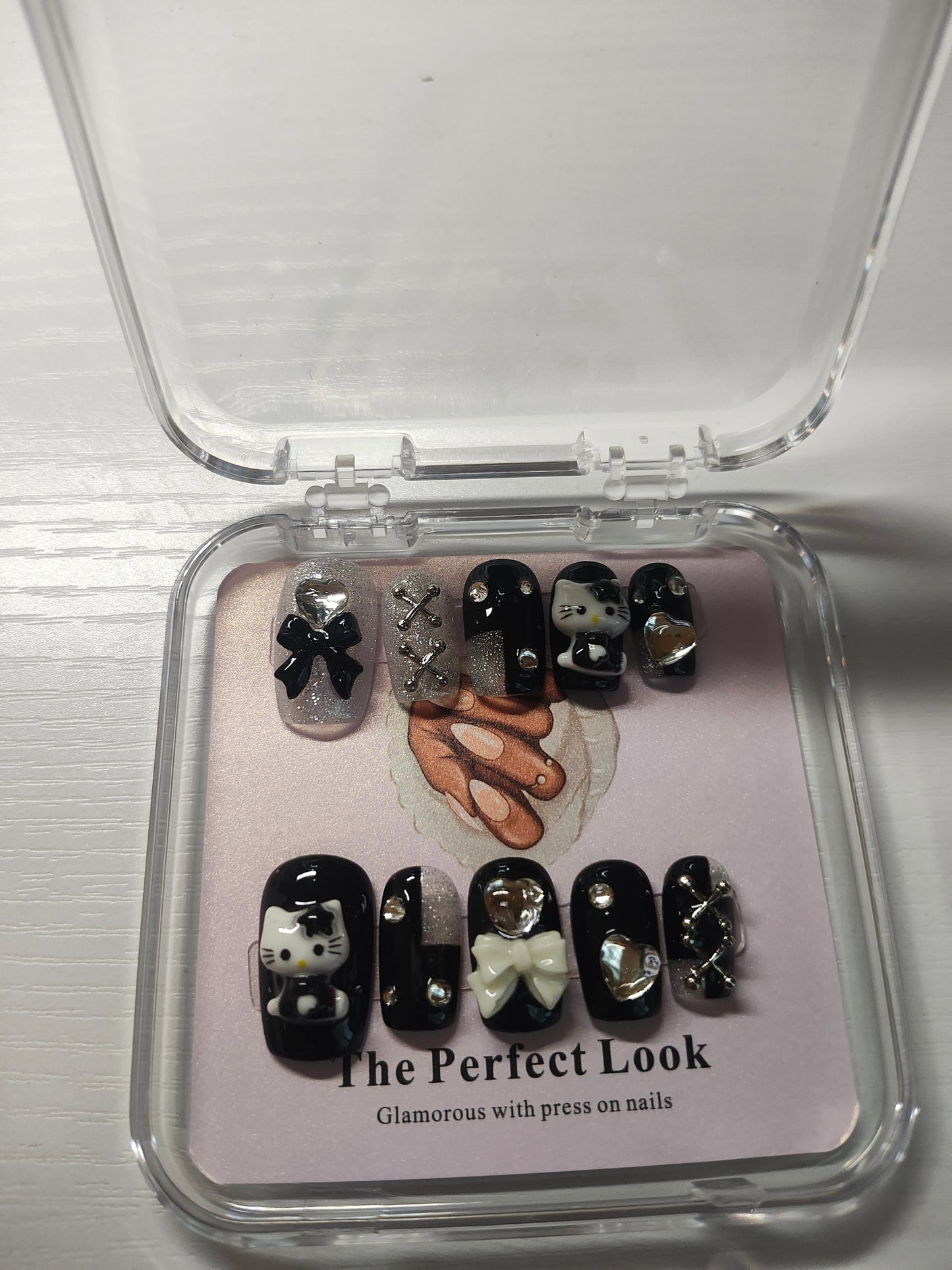 Black and silver hello kitty nails