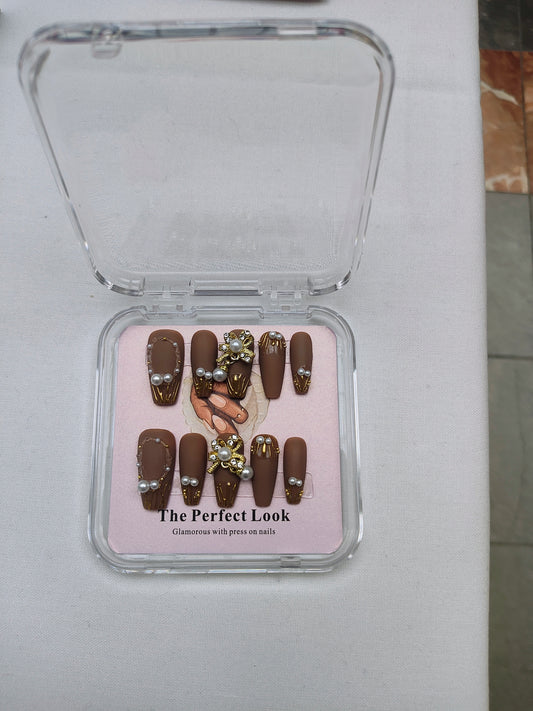 Brown nails with pearl accents